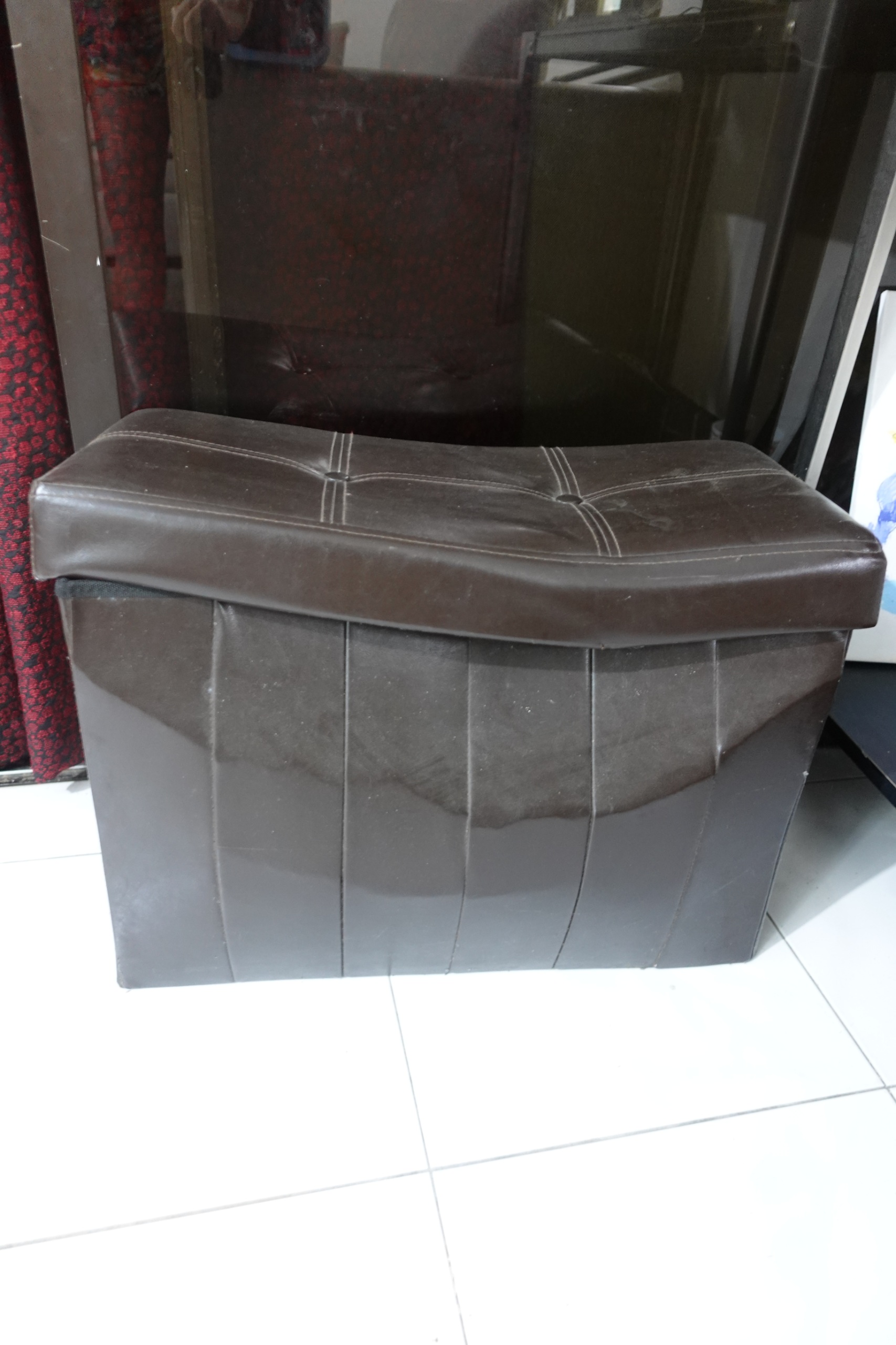 Dark brown faux leather storage ottoman