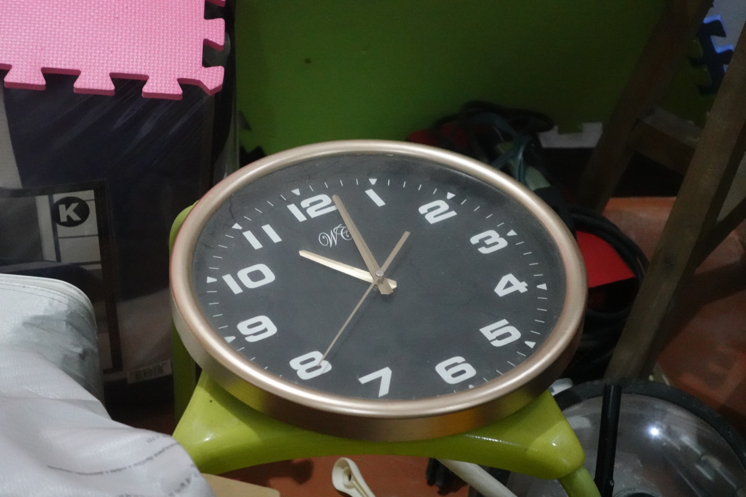 Analog Wall Clock with Gold Rim and Black Face
