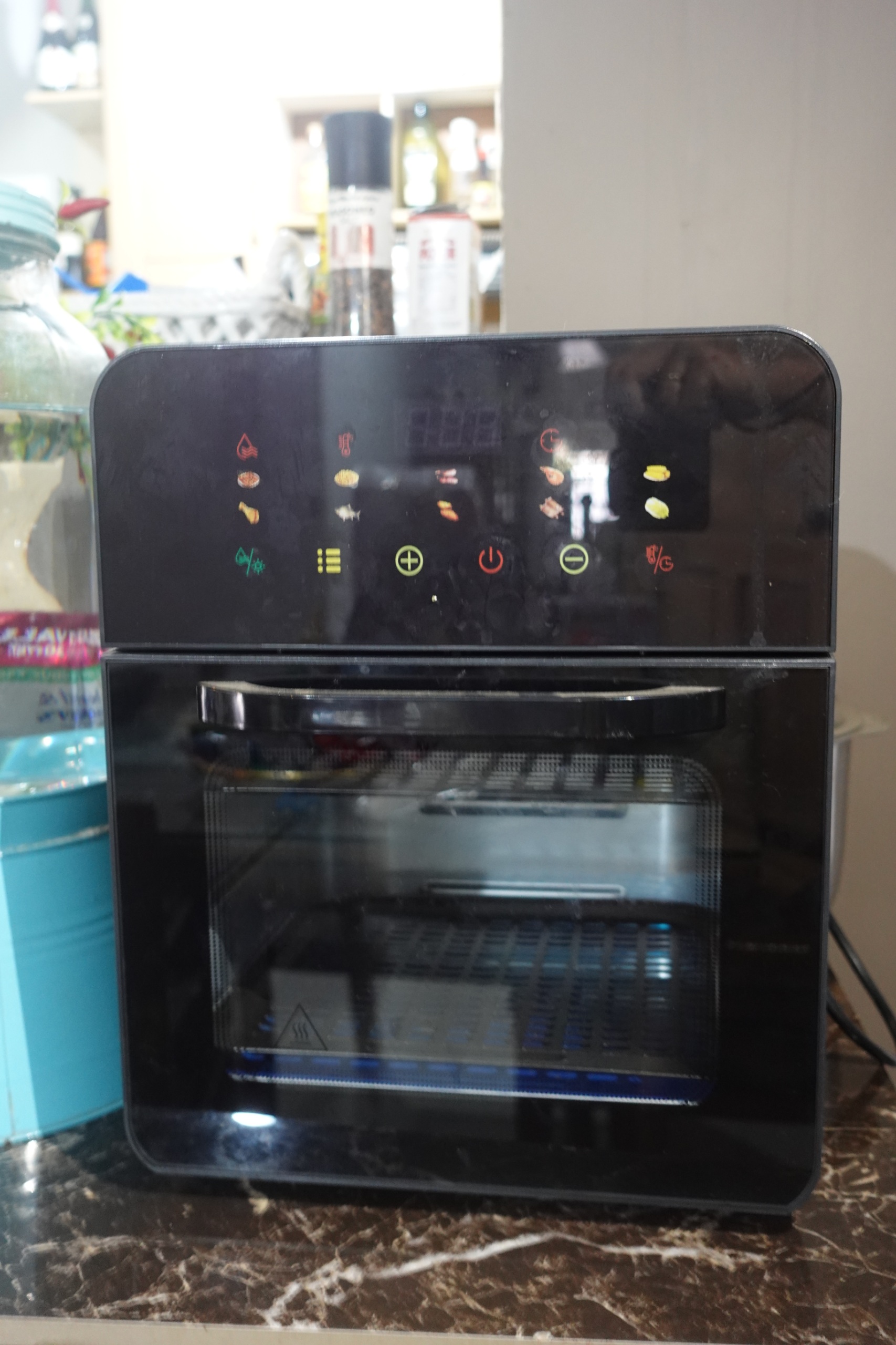 Black countertop air fryer oven with touch panel