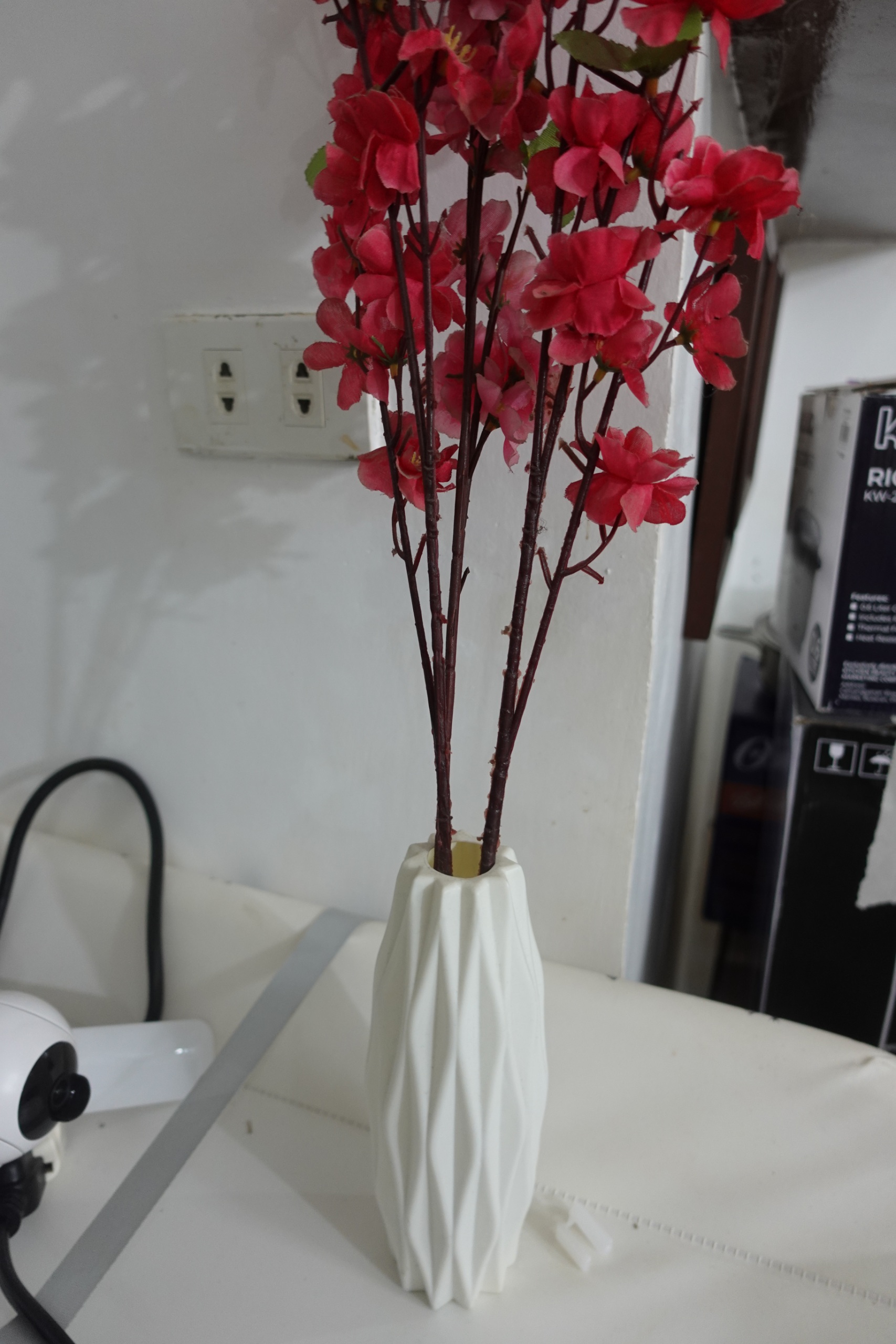 White Ceramic Vase with Red Artificial Flowers