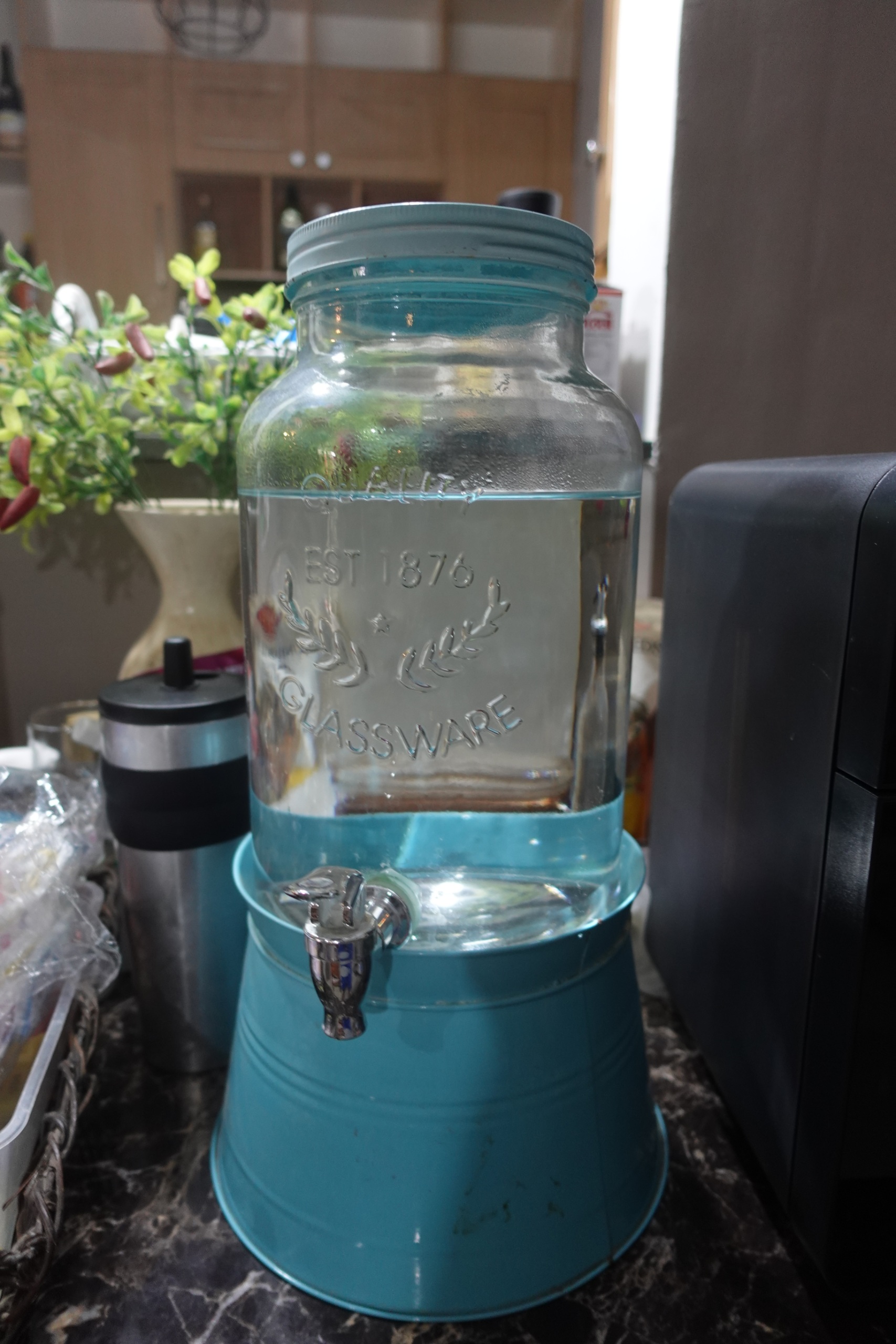Glass Beverage Dispenser with Spigot and Turquoise Stand