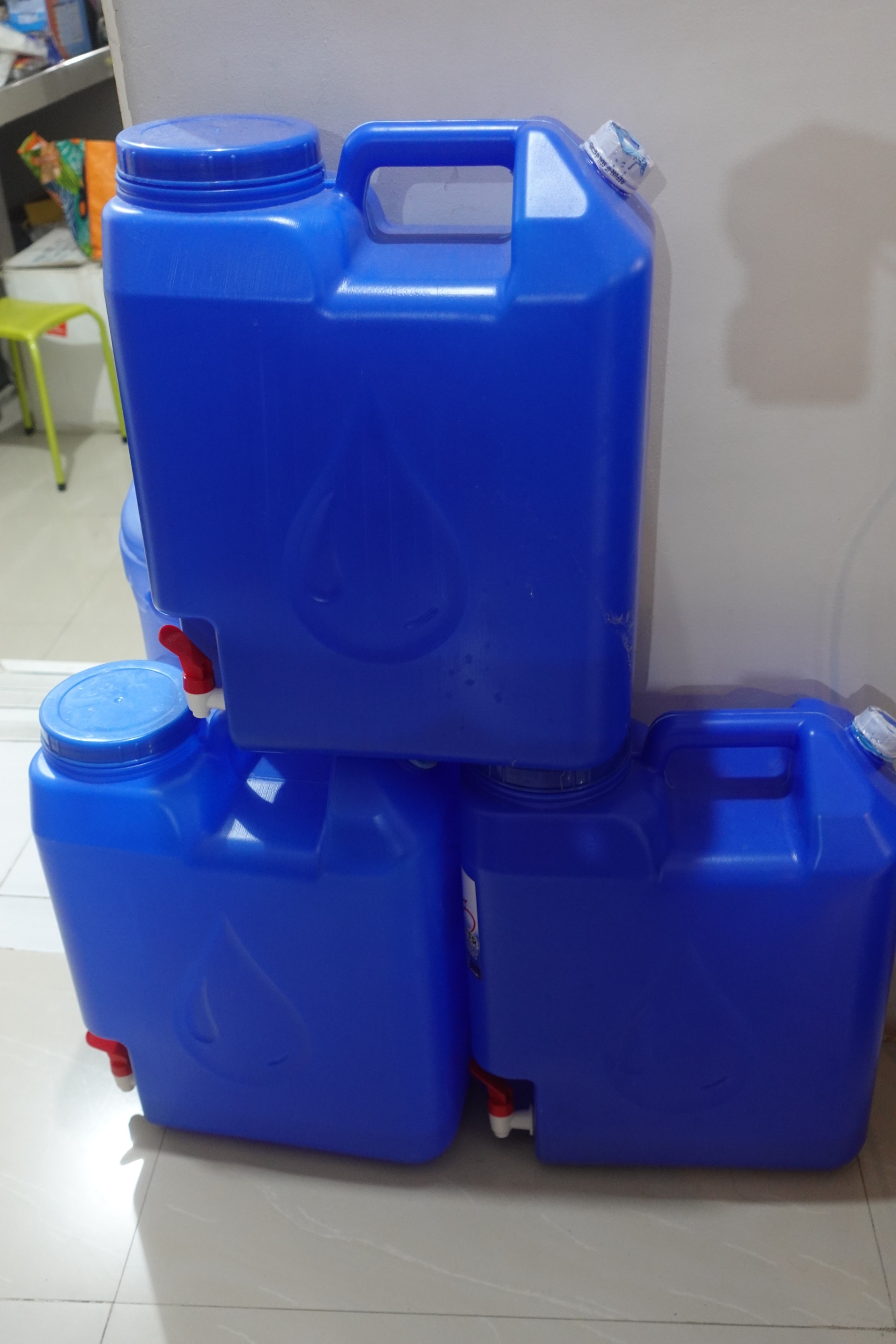 Blue plastic water container with tap