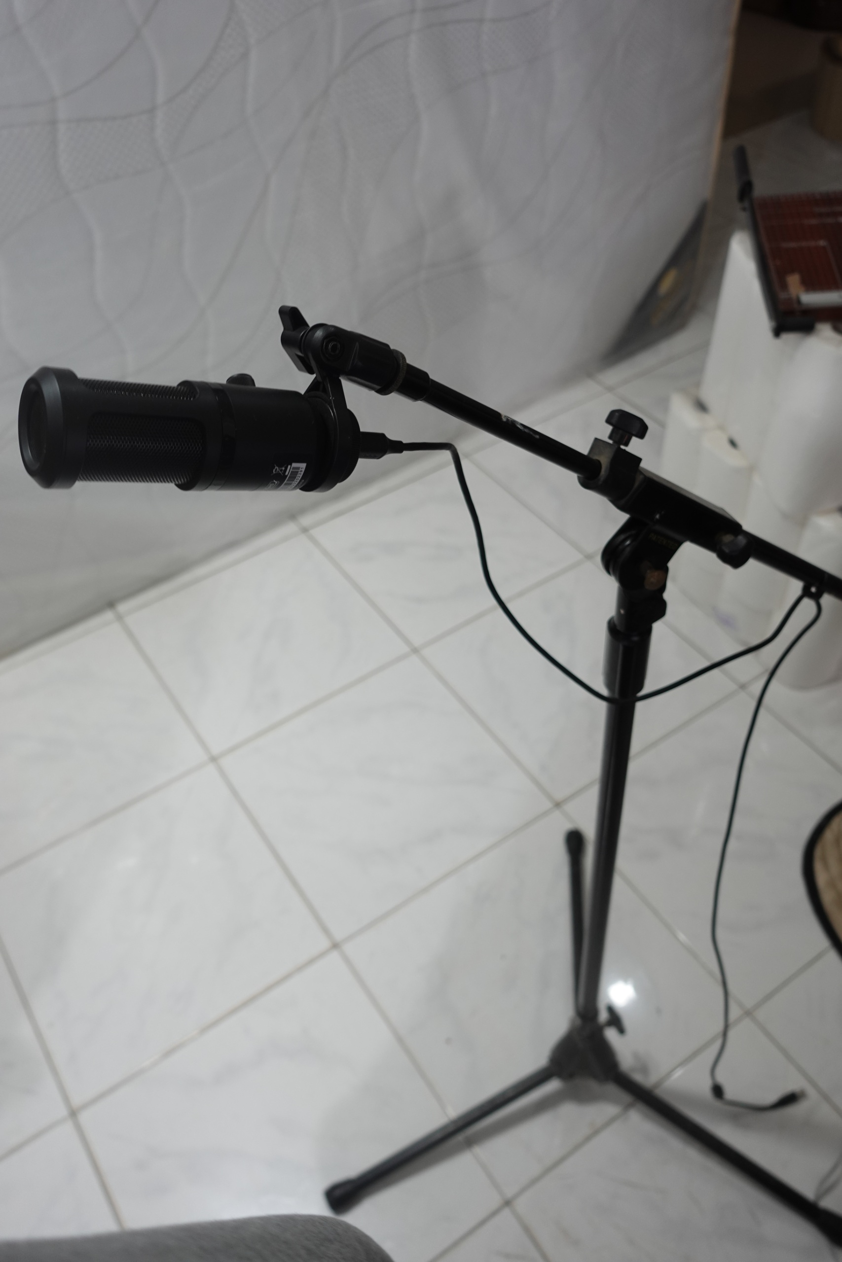 Microphone with adjustable tripod stand and boom arm